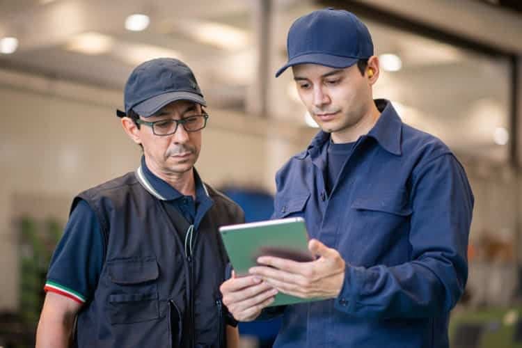 Job Card Software - Technicians working from a device